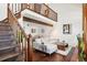 Open living area with hardwood floors, high ceilings and loft at 2103 Ranch Dr, Westminster, CO 80234