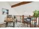 Upstairs loft area features a desk, chair, and hardwood floors at 2103 Ranch Dr, Westminster, CO 80234