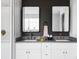 Bathroom showcasing double sinks, modern fixtures, and sleek vanity, offering a luxurious experience at 2941 Oneida St, Denver, CO 80207