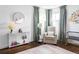Cozy bedroom with neutral tones, soft furnishings, a floral wall decoration, and natural light at 2941 Oneida St, Denver, CO 80207