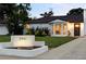 Charming home with an address marker and inviting curb appeal in a well-lit evening setting at 2941 Oneida St, Denver, CO 80207