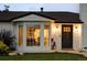 Beautiful home with a brick exterior, a bay window, and a well-manicured front yard at 2941 Oneida St, Denver, CO 80207