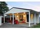 Covered patio with outdoor furniture, a sliding glass door, and view of fenced backyard at 2941 Oneida St, Denver, CO 80207