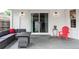 Outdoor patio with modern seating and a sliding glass door for indoor/outdoor living at 2941 Oneida St, Denver, CO 80207