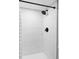 Bathroom featuring white subway tile shower with black showerhead and handle at 2941 Oneida St, Denver, CO 80207