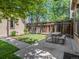 Cozy backyard features a picnic table, grass and wood fence at 2741 Java Ct, Denver, CO 80211