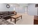 Spacious basement featuring plush seating and neutral carpeting, illuminated by recessed lighting and sconces at 2741 Java Ct, Denver, CO 80211
