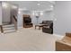 Finished basement featuring gray walls, carpet flooring, and seating area with leather furniture and a large TV at 2741 Java Ct, Denver, CO 80211