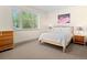 Bright bedroom with large window, carpeted floors, and ample natural light at 2741 Java Ct, Denver, CO 80211