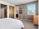 Bedroom with neutral walls, carpet flooring, and closet; bathroom is visible at 2741 Java Ct, Denver, CO 80211