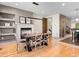 Dining room featuring hardwood floors, a fireplace, and contemporary decor at 2741 Java Ct, Denver, CO 80211