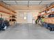 Well-organized garage with concrete floor and wooden shelves, ready for storage and vehicles at 2741 Java Ct, Denver, CO 80211
