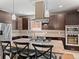 Bright kitchen featuring granite countertops, stainless steel appliances, and ample cabinetry at 2741 Java Ct, Denver, CO 80211