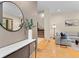 Bright living room featuring hardwood floors, a modern sofa, and stylish decor at 2741 Java Ct, Denver, CO 80211