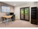 Home office with desk, monitors, and private access to outdoor balcony at 2741 Java Ct, Denver, CO 80211