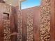 Shower with decorative stone tile accents and built-in niche and corner seat at 2741 Java Ct, Denver, CO 80211
