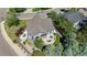 Aerial view of a beautifully landscaped property featuring a patio, fire pit, and lush greenery at 7696 S Hudson Way, Centennial, CO 80122