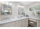 Bright bathroom features double sinks, a vanity area, and updated lighting for an elegant and functional space at 7696 S Hudson Way, Centennial, CO 80122