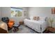 Cozy bedroom with a comfortable daybed, plenty of natural light, and stylish decor for a relaxing retreat at 7696 S Hudson Way, Centennial, CO 80122