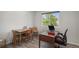 Functional home office space features a desk, chairs, and a scenic view for a productive work environment at 7696 S Hudson Way, Centennial, CO 80122