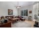 Spacious living room with hardwood floors, neutral colors and abundant light at 7696 S Hudson Way, Centennial, CO 80122
