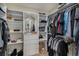 Large walk-in closet with custom shelving and ample storage space for clothing and accessories organization at 7696 S Hudson Way, Centennial, CO 80122
