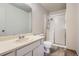 Bathroom featuring a vanity with sink and tiled walk-in shower with sliding doors at 2215 E Geddes Ave # P08, Littleton, CO 80122