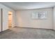 A comfortable bedroom with a closet and window, freshly painted with new carpet at 2215 E Geddes Ave # P08, Littleton, CO 80122