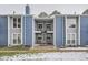Charming condo building featuring light blue siding and exterior stairs at 2215 E Geddes Ave # P08, Littleton, CO 80122
