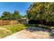 Spacious backyard featuring a storage shed, mature trees, and a concrete patio area perfect for outdoor living at 1371 W 133Rd Way, Denver, CO 80234