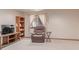 This basement area includes a recliner and TV and is a versatile space for relaxation and entertainment at 1371 W 133Rd Way, Denver, CO 80234