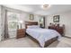 Comfortable bedroom with a wooden bed frame and matching furniture at 1371 W 133Rd Way, Denver, CO 80234