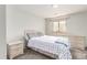 This bedroom boasts a cozy carpet, a window for natural light and neutral colored furniture at 1371 W 133Rd Way, Denver, CO 80234