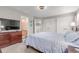 Inviting bedroom with a plush bed, TV, and access to an en-suite bathroom at 1371 W 133Rd Way, Denver, CO 80234