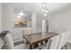 Cozy dining area with a wooden table, chairs, and view to the kitchen at 1371 W 133Rd Way, Denver, CO 80234
