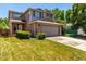 Well-maintained two-story home with an attached two-car garage and mature landscaping at 1371 W 133Rd Way, Denver, CO 80234