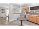 Modern kitchen with a breakfast bar and stainless steel appliances, open to the dining room at 1371 W 133Rd Way, Denver, CO 80234