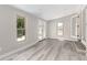 Spacious living room with light-colored flooring and large windows allowing ample natural light at 1371 W 133Rd Way, Denver, CO 80234