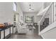 Bright living room with tall ceilings, large windows, and modern decor at 1371 W 133Rd Way, Denver, CO 80234