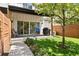 Charming backyard with patio, lush green lawn, and wooden fence, perfect for outdoor living at 3103 S Cherokee St, Englewood, CO 80110