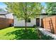 Landscaped backyard with lush lawn and modern wooden fence enhances outdoor appeal at 3103 S Cherokee St, Englewood, CO 80110