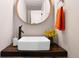 Stylish powder room with a modern sink and a wood countertop at 3103 S Cherokee St, Englewood, CO 80110