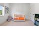 A Bedroom with a patterned accent wall, a modern crib, and a cozy elephant plush at 3103 S Cherokee St, Englewood, CO 80110