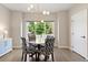 Dining room with modern chandelier and natural light at 3103 S Cherokee St, Englewood, CO 80110