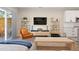 Open-concept living area with hardwood floors and contemporary furniture at 3103 S Cherokee St, Englewood, CO 80110