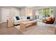 Inviting living room with lots of natural light flowing through a large sliding door at 3103 S Cherokee St, Englewood, CO 80110