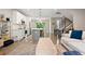 Bright, open floor plan featuring a modern kitchen, living room, and staircase at 3103 S Cherokee St, Englewood, CO 80110