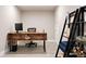 Bright office features modern rustic desk, stylish shelving, and sleek tile floors at 3103 S Cherokee St, Englewood, CO 80110