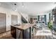 Inviting living room with wood floors, plush seating, and an open layout connected to the kitchen at 17851 E 103Rd Ave, Commerce City, CO 80022