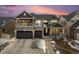 Beautiful two-story home with stone accents, a covered porch and two-car garage at 4981 Liverpool St, Denver, CO 80249